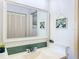 Bright bathroom featuring double vanity and decorative wall art at 460 Bouchelle Dr # 104, New Smyrna Beach, FL 32169