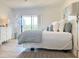 The bedroom has simple décor, a comfortable bed, and a view to the outside, creating a relaxing retreat at 460 Bouchelle Dr # 104, New Smyrna Beach, FL 32169