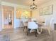Charming dining area with a modern chandelier and stylish seating at 460 Bouchelle Dr # 104, New Smyrna Beach, FL 32169
