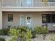Charming condo exterior with attractive landscaping and a welcoming front door at 460 Bouchelle Dr # 104, New Smyrna Beach, FL 32169