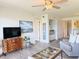 Open-concept living room with waterfront views, modern decor, and a wet bar at 460 Bouchelle Dr # 104, New Smyrna Beach, FL 32169