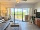 Comfortable living room with stylish decor and stunning waterfront views at 460 Bouchelle Dr # 104, New Smyrna Beach, FL 32169