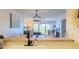 Bright and airy living room seamlessly connects to the dining area and kitchen at 460 Bouchelle Dr # 104, New Smyrna Beach, FL 32169