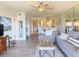 Sunlit living room featuring modern decor, comfortable seating, and an open layout at 460 Bouchelle Dr # 104, New Smyrna Beach, FL 32169