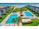 A pristine beachfront complex with lush lawns, pools, and easy beach access for a perfect vacation spot at 4841 Saxon Dr # C201, New Smyrna Beach, FL 32169