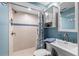 Light and bright full bathroom with walk-in shower and blue accents at 4841 Saxon Dr # C201, New Smyrna Beach, FL 32169