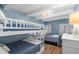 Bedroom with full-over-full bunk beds and a view of the ocean from the window at 4841 Saxon Dr # C201, New Smyrna Beach, FL 32169