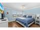 Comfortable bedroom featuring a large window with exterior views at 4841 Saxon Dr # C201, New Smyrna Beach, FL 32169