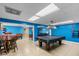 Relax and have fun in the game room featuring a pool table, foosball table, and comfortable seating areas at 4841 Saxon Dr # C201, New Smyrna Beach, FL 32169