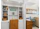 Bright office space featuring built-in shelving, cabinets and natural light at 4841 Saxon Dr # C201, New Smyrna Beach, FL 32169