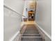 Carpeted staircase leading to the main living area of the home at 4841 Saxon Dr # C201, New Smyrna Beach, FL 32169