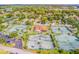 An aerial view featuring tennis courts, a clubhouse, and the surrounding community at 5 Soco Trl, Ormond Beach, FL 32174