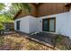 Backyard patio with sliding glass door; a serene outdoor space great for relaxation and entertaining at 5 Soco Trl, Ormond Beach, FL 32174