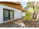 The backyard features a concrete patio and a sliding glass door providing access to the home at 5 Soco Trl, Ormond Beach, FL 32174