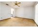 Bedroom with ceiling fan has an ensuite bathroom, offering convenience and privacy at 5 Soco Trl, Ormond Beach, FL 32174