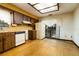 Cozy kitchen featuring ample cabinet space, basic appliances, and a bright window at 5 Soco Trl, Ormond Beach, FL 32174