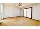Bright living room with a ceiling fan and a sliding glass door, offering a spacious layout at 5 Soco Trl, Ormond Beach, FL 32174