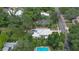 An aerial view of a private residence featuring a backyard pool, covered patio, and private parking at 508 Faulkner St, New Smyrna Beach, FL 32168
