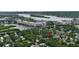 An aerial view of a waterfront community featuring multi story condominium buildings, waterways, and local homes at 508 Faulkner St, New Smyrna Beach, FL 32168