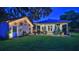 Backyard featuring a charming shed, patio, lush lawn, and outdoor seating area with string lights at 508 Faulkner St, New Smyrna Beach, FL 32168