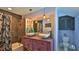 Bathroom with vessel sinks, large mirror, and a shower-tub combo at 508 Faulkner St, New Smyrna Beach, FL 32168