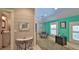 Bright bedroom featuring two windows, accent chair, and decor at 508 Faulkner St, New Smyrna Beach, FL 32168