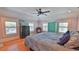 Bedroom with neutral walls, hardwood floors, and multiple windows providing natural light at 508 Faulkner St, New Smyrna Beach, FL 32168