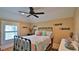 Bedroom featuring ceiling fan, colorful quilt and unique fish decorations at 508 Faulkner St, New Smyrna Beach, FL 32168