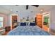 Bedroom with neutral walls, hardwood floors, walk-in closet, and ample sunlight at 508 Faulkner St, New Smyrna Beach, FL 32168