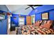 Blue bedroom with American themed decorations and fan at 508 Faulkner St, New Smyrna Beach, FL 32168