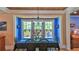 Bright dining room with large windows and a stylish chandelier at 508 Faulkner St, New Smyrna Beach, FL 32168