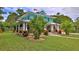 Charming two-story home with landscaped yard and covered porch at 508 Faulkner St, New Smyrna Beach, FL 32168