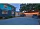 Rear view of the residence showcasing the backyard, detached garage, and ample parking space at 508 Faulkner St, New Smyrna Beach, FL 32168