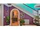 Charming foyer with a decorative arched door, colorful walls, and unique architectural details at 508 Faulkner St, New Smyrna Beach, FL 32168