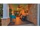 Inviting porch with stone columns, ceiling fans, and comfortable seating arrangements at 508 Faulkner St, New Smyrna Beach, FL 32168