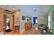 Hallway features light gray plank walls, wood floors, and doorways leading to various rooms at 508 Faulkner St, New Smyrna Beach, FL 32168