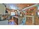 Stylish kitchen featuring a center island, modern appliances, brick accents, and hanging pendant lights at 508 Faulkner St, New Smyrna Beach, FL 32168