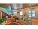 Comfortable living room featuring hardwood floors, a ceiling fan, and a cozy seating arrangement at 508 Faulkner St, New Smyrna Beach, FL 32168