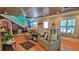 Cozy living room with hardwood floors, a decorative ceiling fan, and a comfortable seating area with a couch and armchair at 508 Faulkner St, New Smyrna Beach, FL 32168