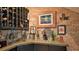 Home wine cellar with brick walls, a wine rack, and a countertop display of glasses and bottles at 508 Faulkner St, New Smyrna Beach, FL 32168