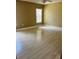 A bedroom featuring neutral colored walls, light hardwood flooring and a ceiling fan at 519 Aeolian Dr, New Smyrna Beach, FL 32168
