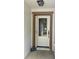 A white front door with decorative glass details and a 'Welcome' stone decor at 519 Aeolian Dr, New Smyrna Beach, FL 32168