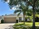 Charming single-story home with a well-manicured lawn and a two-car garage at 519 Aeolian Dr, New Smyrna Beach, FL 32168