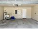 Spacious two-car garage with concrete floors and lots of storage space at 519 Aeolian Dr, New Smyrna Beach, FL 32168