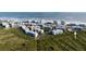 Aerial view of condo community with beach access surrounded by natural landscape at 5300 S Atlantic Ave # 17-207, New Smyrna Beach, FL 32169