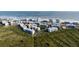 Aerial view of condo community with beach access surrounded by natural landscape at 5300 S Atlantic Ave # 17-207, New Smyrna Beach, FL 32169