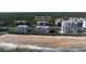 Aerial view showcasing Oceanwalk condos community and New Smyrna Beach, Florida at 5300 S Atlantic Ave # 17-207, New Smyrna Beach, FL 32169