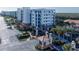 Gated condo building entrance showcasing lush landscaping and well maintained grounds at 5300 S Atlantic Ave # 17-207, New Smyrna Beach, FL 32169