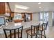 Spacious kitchen featuring stainless steel appliances, granite countertops, and a breakfast bar with seating at 5300 S Atlantic Ave # 17-207, New Smyrna Beach, FL 32169