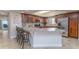 Gourmet kitchen featuring granite countertops, stainless steel appliances, and ample counter space at 5300 S Atlantic Ave # 17-207, New Smyrna Beach, FL 32169